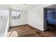 Bright bedroom featuring a window, neutral walls, and brown carpet at 1115 Cherry Ct, Fort Lupton, CO 80621