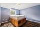 Basement bedroom featuring custom built in bed with storage compartments and a window at 1115 Cherry Ct, Fort Lupton, CO 80621
