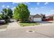 Charming single-Gathering home with lush green lawn, mature tree, and long driveway at 1115 Cherry Ct, Fort Lupton, CO 80621
