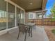 Inviting covered patio featuring a table and chairs, perfect for outdoor relaxation and entertaining at 9844 Truckee St, Commerce City, CO 80022
