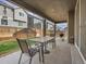 Charming covered patio with a grill and table set, ideal for enjoying outdoor meals and gatherings at 9844 Truckee St, Commerce City, CO 80022