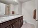Bathroom vanity and ample countertop space, accented with a framed mirror at 9844 Truckee St, Commerce City, CO 80022