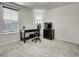 Well-lit bedroom with desk, drawers, comfortable office chair and large window at 9844 Truckee St, Commerce City, CO 80022