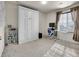 Spare bedroom featuring a convenient murphy bed and desk next to a window at 9844 Truckee St, Commerce City, CO 80022