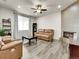 Cozy living room with a modern fireplace and a comfortable seating area at 9844 Truckee St, Commerce City, CO 80022