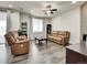 Inviting living room with ceiling fan and modern decor at 9844 Truckee St, Commerce City, CO 80022