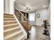 Foyer leading into the living room featuring a staircase at 9844 Truckee St, Commerce City, CO 80022