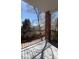 Enjoy outdoor living on this balcony with wrought iron railing and views of the surrounding neighborhood at 1878 S Cole St, Lakewood, CO 80228