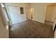 Bedroom with carpeting, closet, and private entry to the ensuite bathroom at 1878 S Cole St, Lakewood, CO 80228