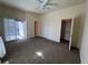 Bright bedroom features sliding glass door, ample closet space, and ensuite bathroom at 1878 S Cole St, Lakewood, CO 80228