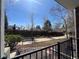 Peaceful view from the front porch showcasing the community's park and walking path at 1878 S Cole St, Lakewood, CO 80228