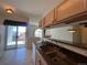 Kitchen with a granite countertop, double sink, and an adjacent sliding glass door to the deck at 1878 S Cole St, Lakewood, CO 80228