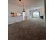 Spacious living room featuring plush carpeting, fireplace, and abundant natural light at 1878 S Cole St, Lakewood, CO 80228