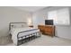 Bright bedroom showcasing a white brick accent wall and neutral decor at 8755 Chase Dr # 167, Arvada, CO 80003