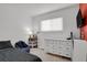 Inviting bedroom with blue beanbag chair and a white dresser at 8755 Chase Dr # 167, Arvada, CO 80003