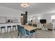 Open layout of the dining area and kitchen and living room with plenty of natural light at 8755 Chase Dr # 167, Arvada, CO 80003