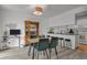 Bright dining area adjacent to the kitchen, featuring contemporary furnishings and stylish decor at 8755 Chase Dr # 167, Arvada, CO 80003