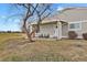 Inviting front exterior featuring a charming covered porch with a seating area and well-maintained landscaping at 8755 Chase Dr # 167, Arvada, CO 80003