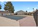 Community pool area with fencing for safety, surrounded by residences, and lush trees at 8755 Chase Dr # 167, Arvada, CO 80003