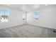 Bright bedroom with gray carpet, neutral walls, and natural light through three windows at 3282 N Catawba Way, Aurora, CO 80019