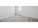 Bedroom with a view out the window, neutral walls and carpet at 3282 N Catawba Way, Aurora, CO 80019