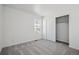 Bedroom with a view out the window, neutral carpet, and a closet at 3282 N Catawba Way, Aurora, CO 80019