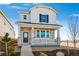 Charming two-story home featuring stone accents, a cozy porch, and a well-maintained front yard at 3282 N Catawba Way, Aurora, CO 80019