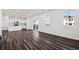 Open concept space featuring sleek floors, modern kitchen and access to the backyard at 3282 N Catawba Way, Aurora, CO 80019
