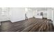 Open concept space featuring sleek floors, a staircase, and modern kitchen at 3282 N Catawba Way, Aurora, CO 80019