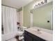 This bathroom offers a shower-tub combo and spacious vanity at 5455 S Dover St # 101, Littleton, CO 80123