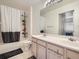 Clean bathroom with tub and shower combo, double sink vanity at 5455 S Dover St # 101, Littleton, CO 80123