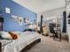 bedroom, featuring a blue accent wall and natural light at 5455 S Dover St # 101, Littleton, CO 80123