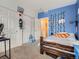This bedroom has a great blue accent wall and closet for storage at 5455 S Dover St # 101, Littleton, CO 80123