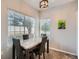 A naturally lit dining room with seating for four, perfect for cozy meals at 5455 S Dover St # 101, Littleton, CO 80123