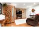 Finished basement with a cozy fireplace, entertainment setup, and ample space for relaxation at 7344 S Sheephorn Mtn, Littleton, CO 80127