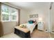 Charming bedroom with bench, natural light, and a calming color palette for relaxation at 7344 S Sheephorn Mtn, Littleton, CO 80127
