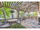 Charming back deck with a wooden pergola, outdoor furniture, and serene views of the backyard at 7830 W 90Th Ave # 67, Broomfield, CO 80021