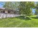 Expansive backyard featuring a well-maintained lawn, mature trees, and a fence, offering privacy at 7830 W 90Th Ave # 67, Broomfield, CO 80021