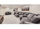 Spacious finished basement featuring comfortable seating, a home gym area, and recessed lighting at 7830 W 90Th Ave # 67, Broomfield, CO 80021