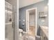 Full bathroom with a glass-enclosed shower and a floating vanity at 7830 W 90Th Ave # 67, Broomfield, CO 80021