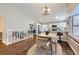 Open concept dining area with stairs, hardwood floors, and seamless access to the kitchen at 7830 W 90Th Ave # 67, Broomfield, CO 80021