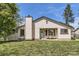 Charming single-story home with cream siding, a chimney, and a well-maintained lawn at 7830 W 90Th Ave # 67, Broomfield, CO 80021