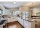 Bright kitchen featuring granite counters, white cabinets, and stainless steel appliances at 7830 W 90Th Ave # 67, Broomfield, CO 80021