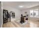 Well-lit office with wood floors, a large window, and a workstation at 7830 W 90Th Ave # 67, Broomfield, CO 80021