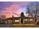 Ranch-style home with attached garage and landscaped yard at 2898 S Patton Ct, Denver, CO 80236