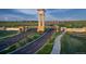 The Aurora Highlands community entrance with a clock tower and landscaped grounds at 3355 N Coolidge Way, Aurora, CO 80019