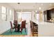 Dining area with natural light, a modern chandelier, and direct access to the backyard at 4330 N Raleigh St, Denver, CO 80212