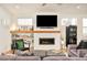 Spacious living room with a sleek fireplace, custom shelving, and contemporary decor at 4330 N Raleigh St, Denver, CO 80212