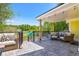 Outdoor patio with comfortable seating area and beautiful backyard views, perfect for relaxing and entertaining at 3962 Hoyt Ct, Wheat Ridge, CO 80033