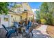 Backyard patio with fire pit, and multiple chairs, great for entertaining and relaxing at 3962 Hoyt Ct, Wheat Ridge, CO 80033